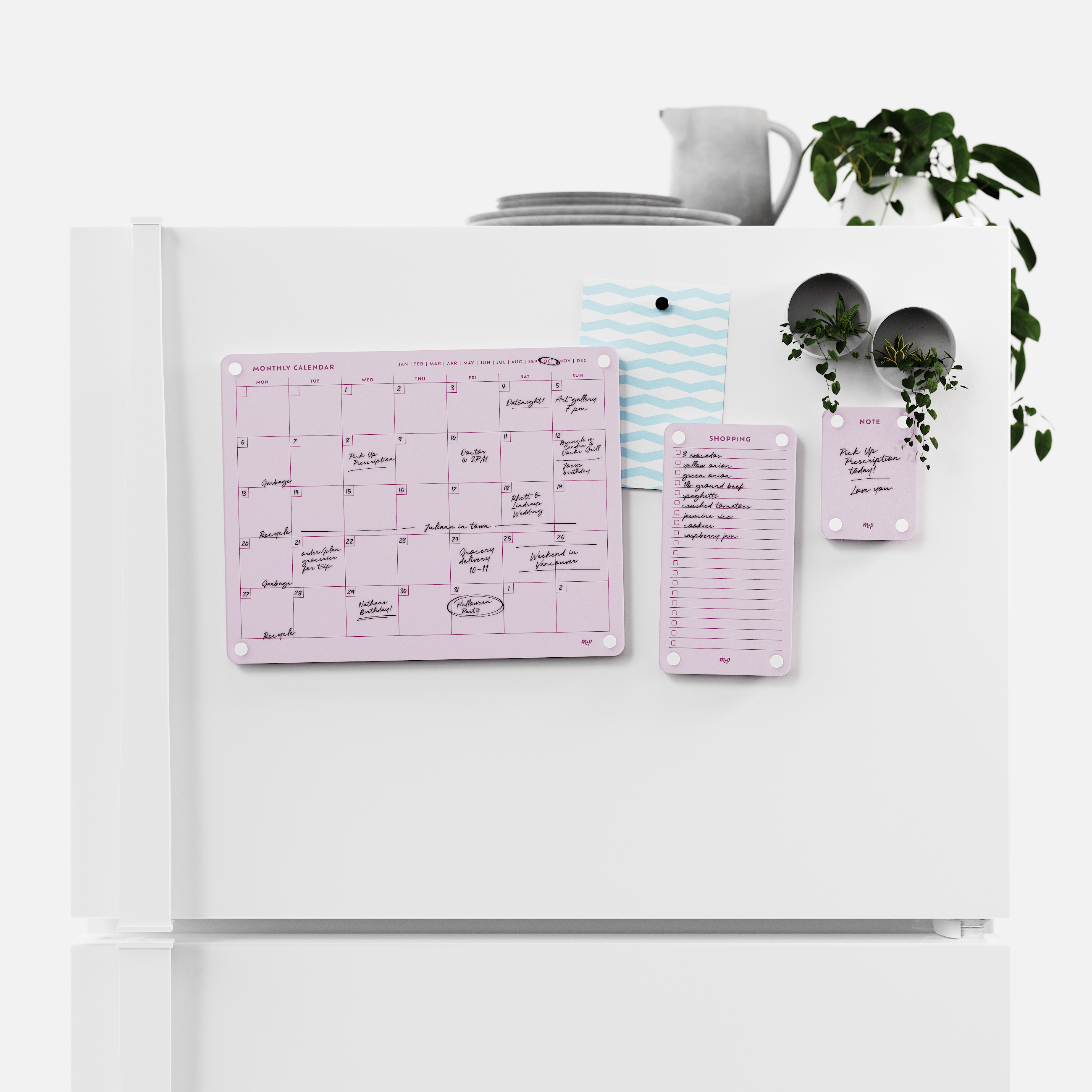 Ballet pink monthly calendar, shopping list and note board magnetised to a white fridge door